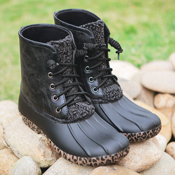 leopard duck boots on rocks