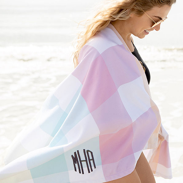 https://images.marleylilly.com/profiles/ml-product-detail/product/521/BF7-rainbow-gingham-monogrammed-beach-towel-wrapped-around-girl.jpg
