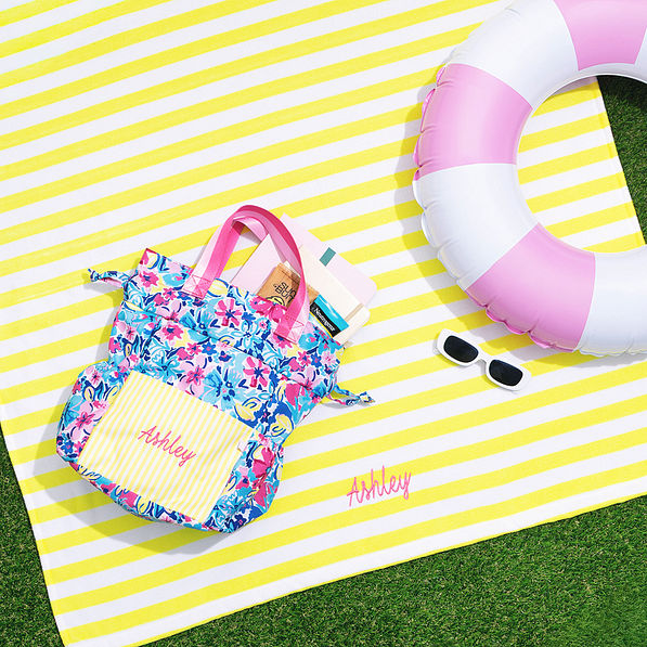 personalized beach towel in sunshine stripes with pool float