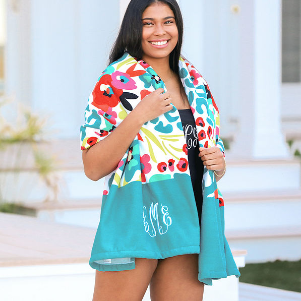 Wild Blooms beach towel around neck at the pool