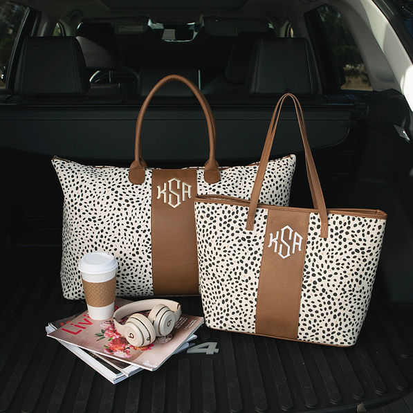 monogrammed spotted weekender with matching tote bag in back of car