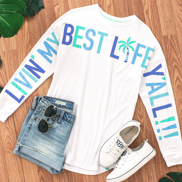 white long sleeve tee with livin my best life text