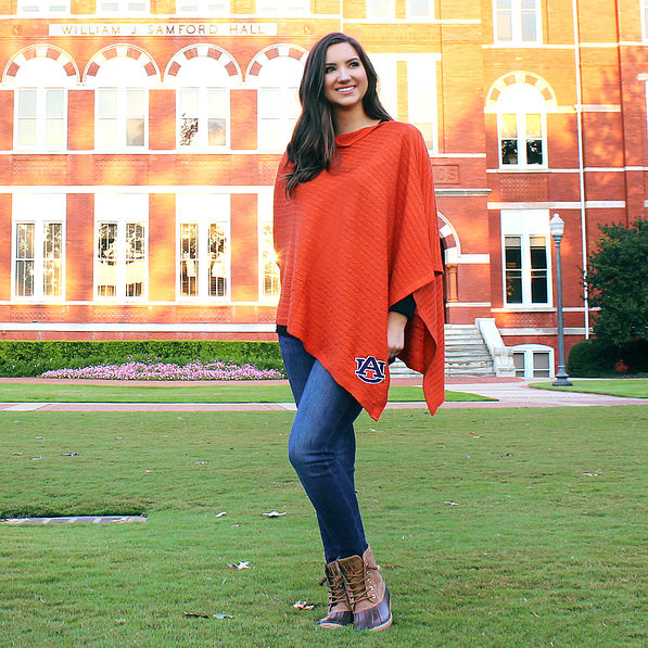 student wearing auburn poncho at william stamford hall