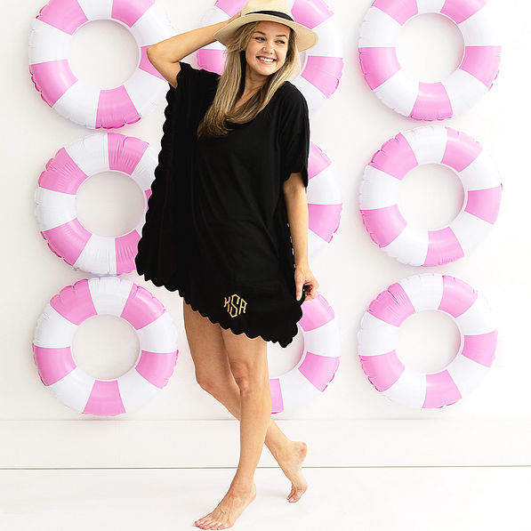 girl in black bathing suit cover over pool rings