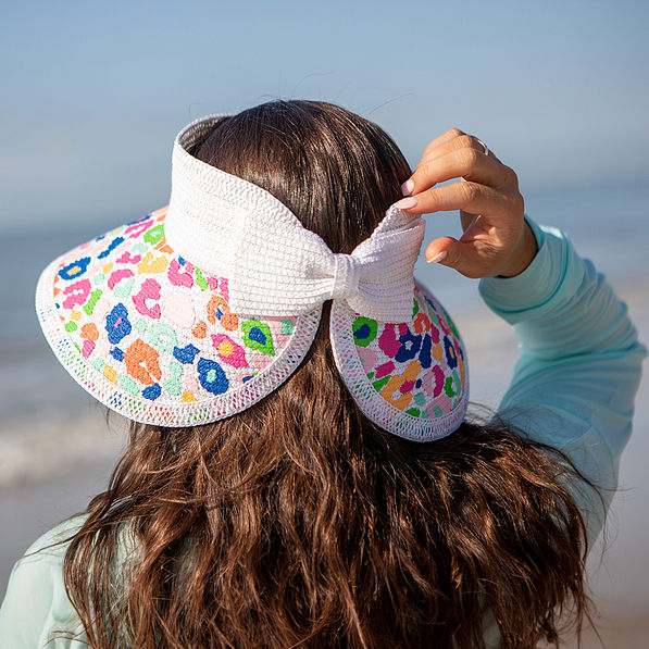 Back of Multi Leopard Straw Visor at beach