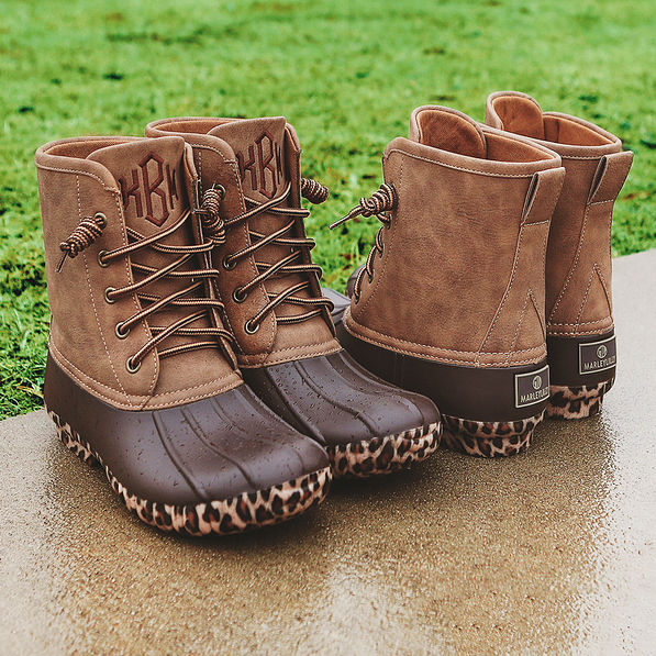 monogrammed leopard sole duck boots front and back on concrete