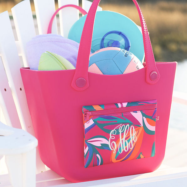personalized waterproof beach bag in pink island sunset on beach chair