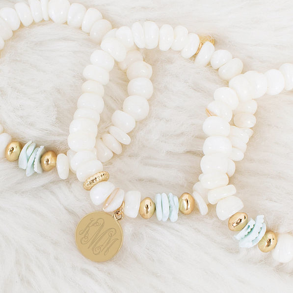 stone bracelet stack on faux fur rug