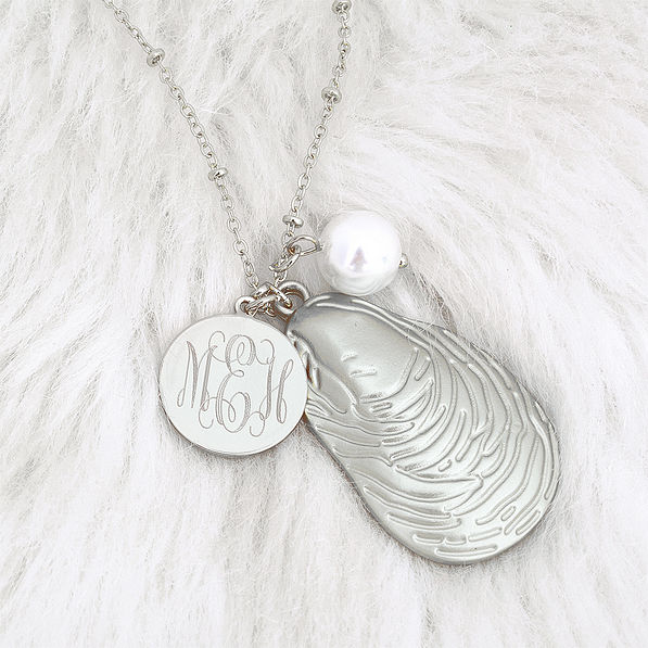 detail shot of silver oyster necklace
