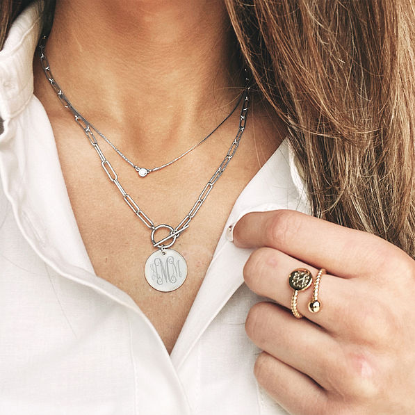 silver pendant necklace with collared shirt