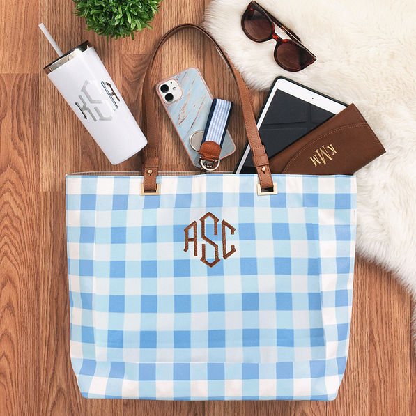 items spilled out of large tote with cognac monogram