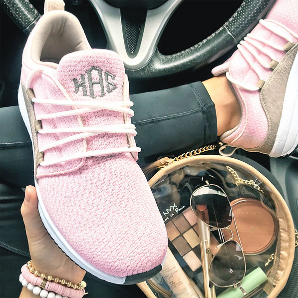 monogrammed pink athletic sneakers in car