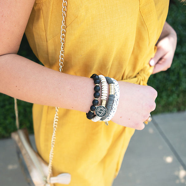 monogrammed spotted bracelet set with yellow jumpsuit