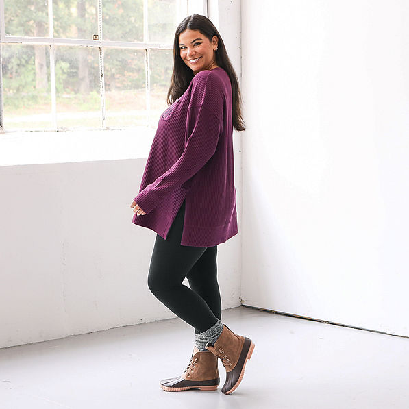 side view of model wearing wine sweatshirt