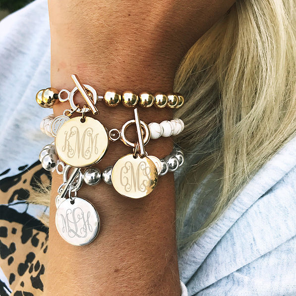 monogrammed ball bracelets on wrist