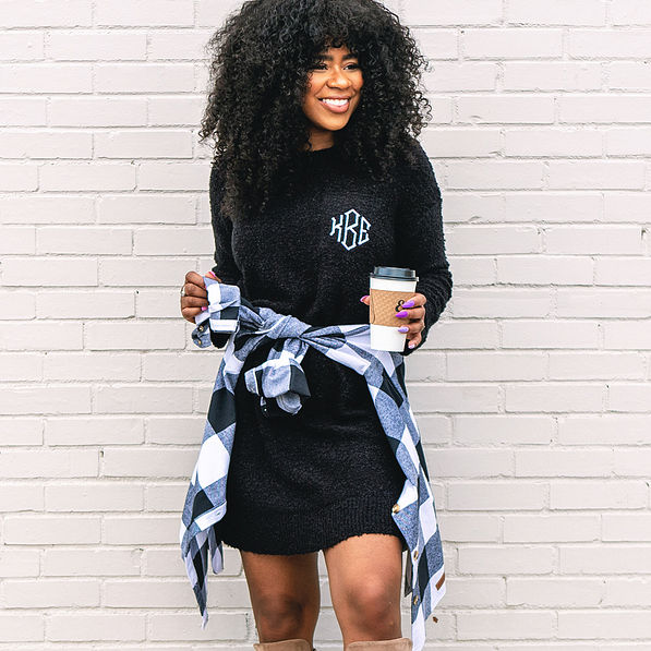 black sweater dress with monogrammed shacket tied around waist