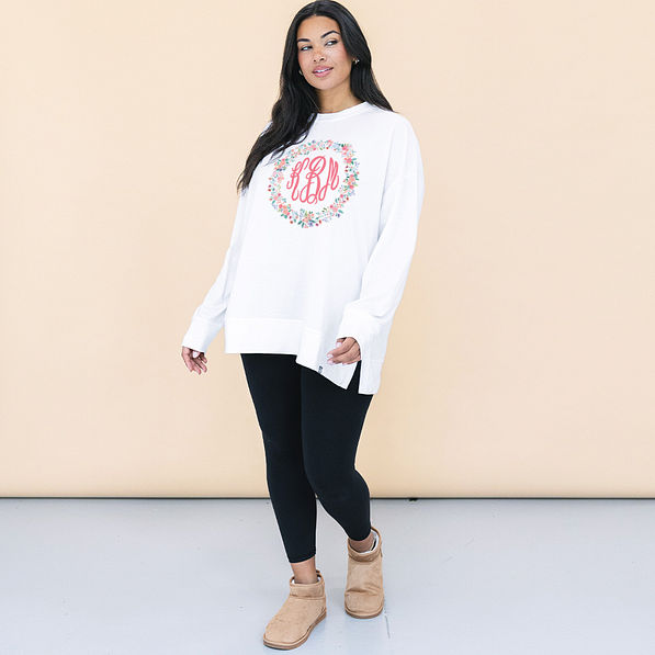 girl wearing personalized crewneck with coral floral design