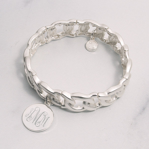 silver monogrammed stretchy bracelet on marble