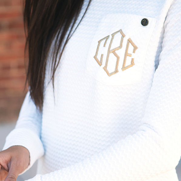 close up of monogrammed quilted sweatshirt