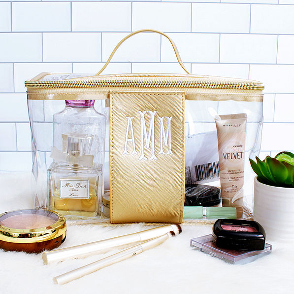 monogrammed clear train case in bathroom