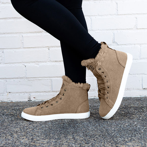 side view of tan sneakers