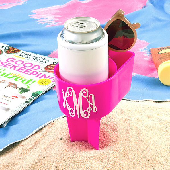 monogrammed sand buddy in sand and towel