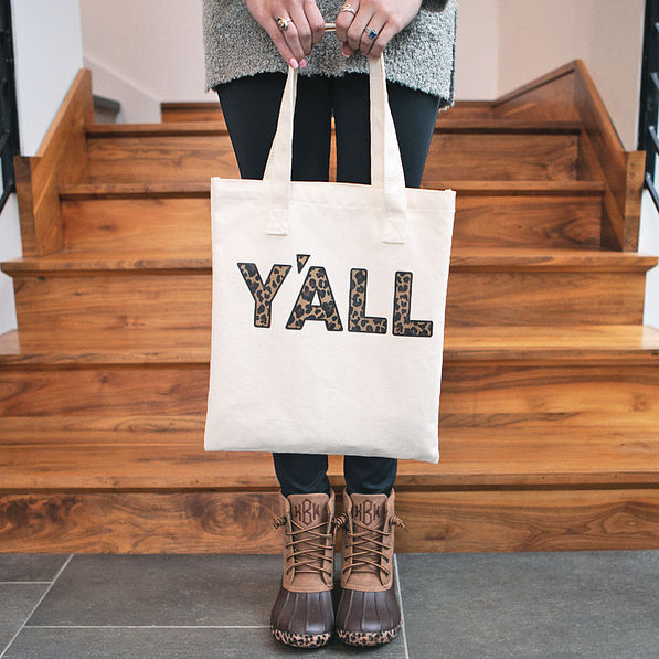 girl holding yall tote