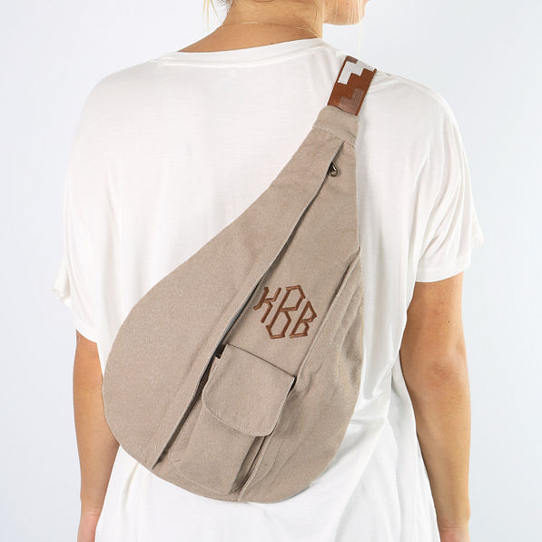 taupe sling pack on back