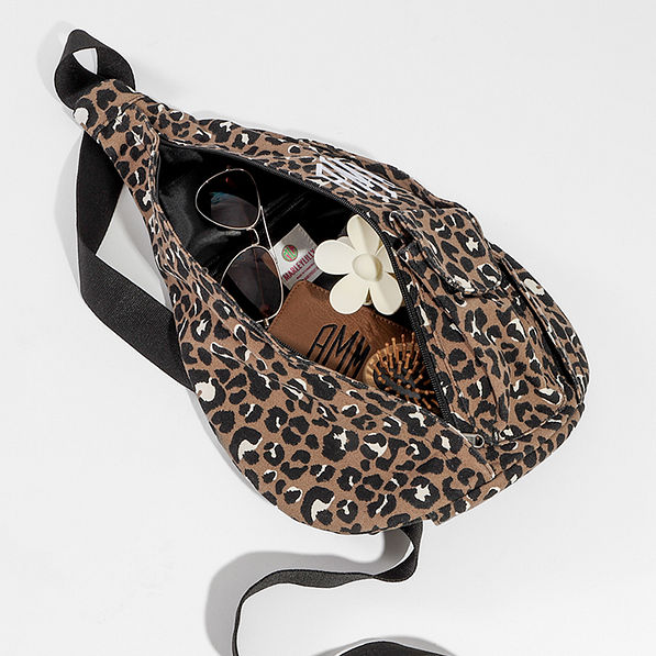 open zipper on cheetah sling pack