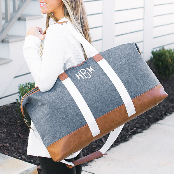 monogrammed chambray weekender on shoulder