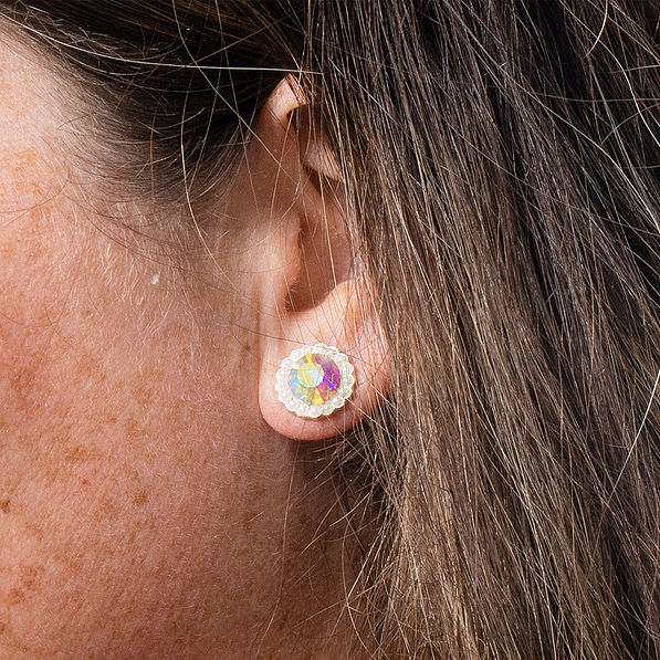 iridescent pave stud earrings in ear