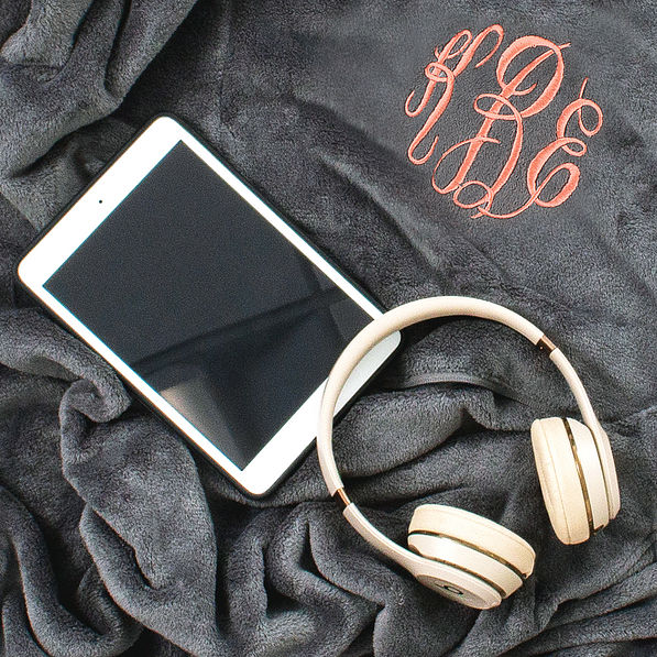 detail of monogrammed packable travel blanket