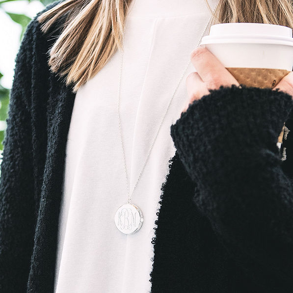 long silver monogrammed locket necklace with white tee