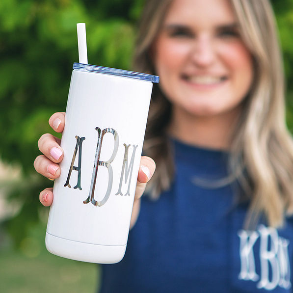 white tumbler with silver monogram