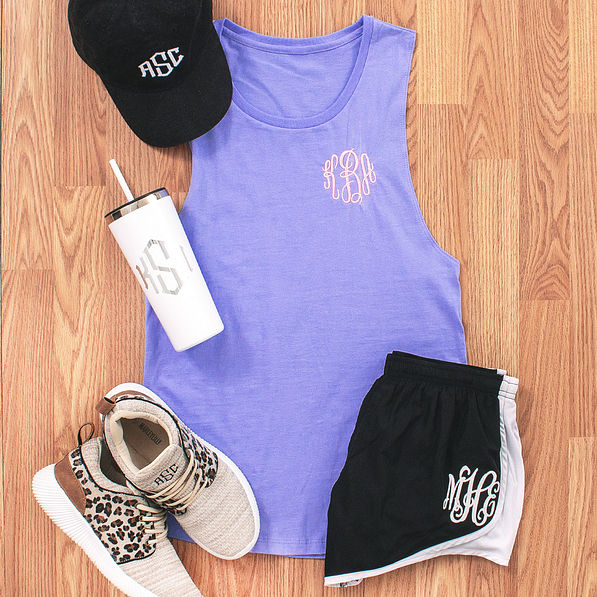 lilac monogrammed tank with running shorts and leopard sneakers