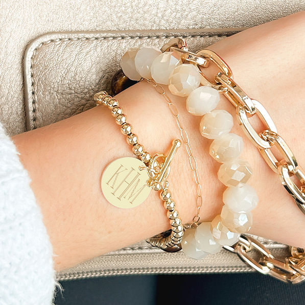 gold dainty bracelet on arm