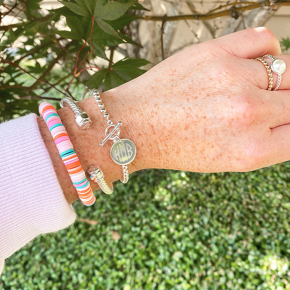 silver dainty bracelet on arm