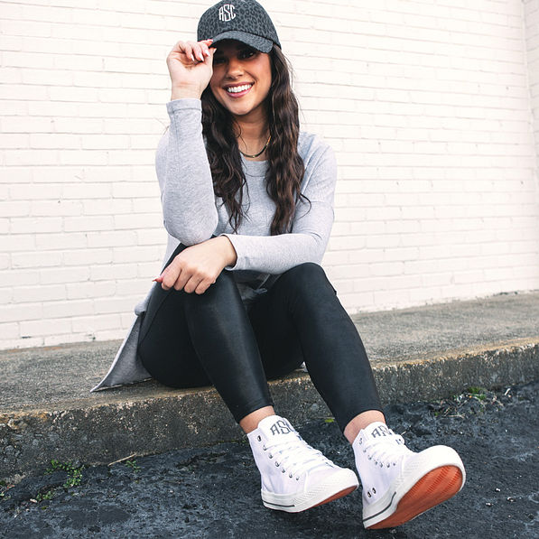 athleisure outfit with monogrammed high top canvas sneakers