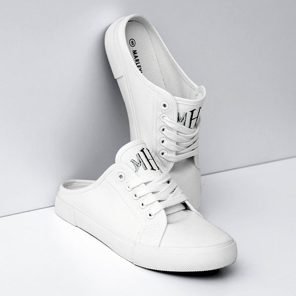 white slide on sneaker studio shot