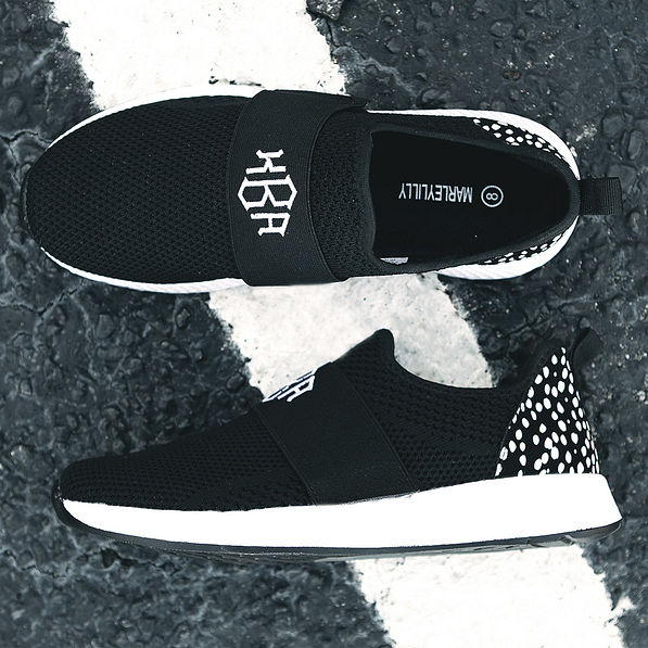 top and side views of monogrammed slip on sneakers