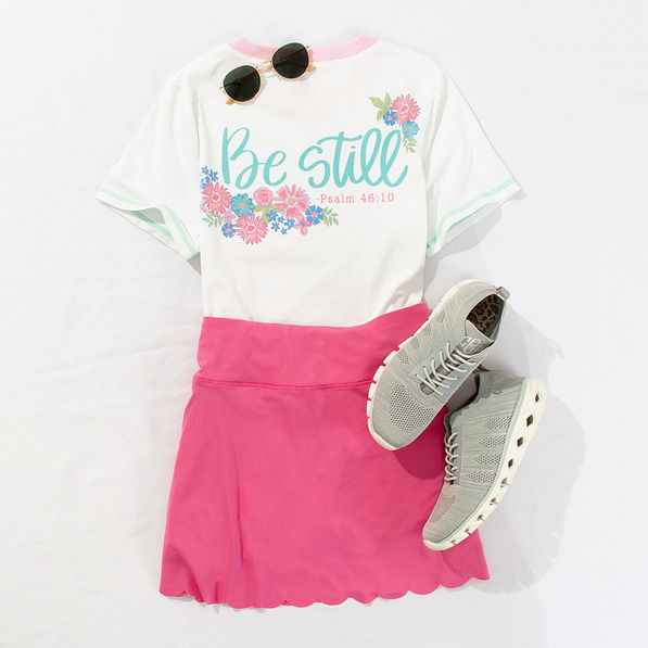 athleisure outfit of the day with graphic tee and skort