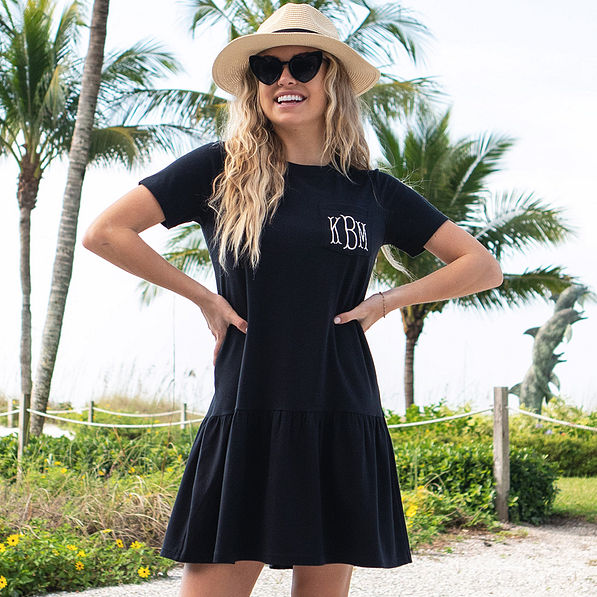 black ruffle dress on beach