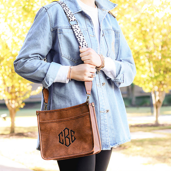 white leopard saddlebag on shoulder