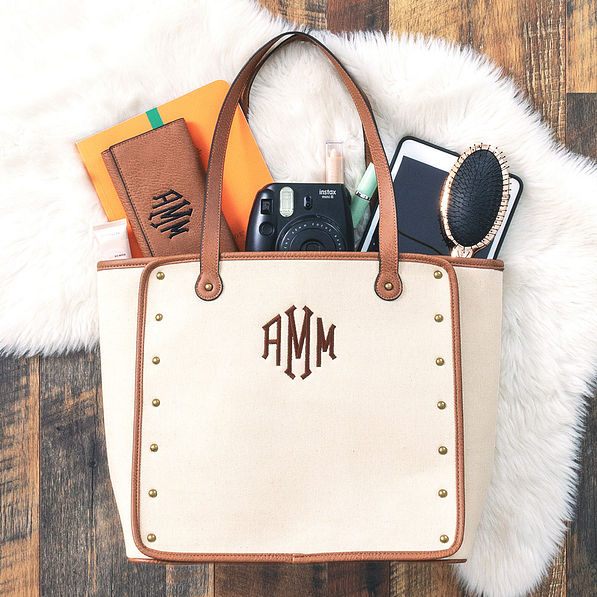 monogrammed vintage canvas tote with accessories spilling out