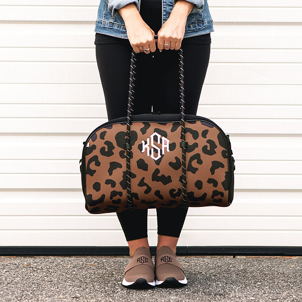 hickory leopard neoprene gym bag in hands