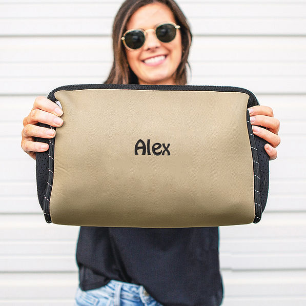 Girl Holding Tan Neoprene Cosmetic Case with Name
