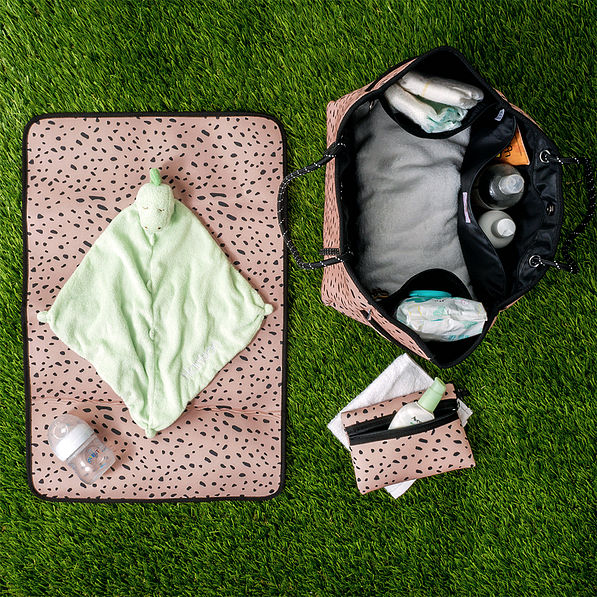 monogrammed neoprene diaper bag in blush safari on grass