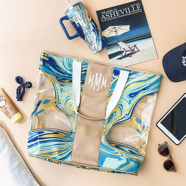 navy blue massive beach bag with monogrammed tumbler and beach accessories