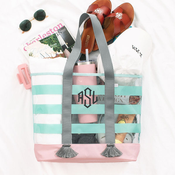 clear beach tote in cabana stripes with sandals and beach accessories