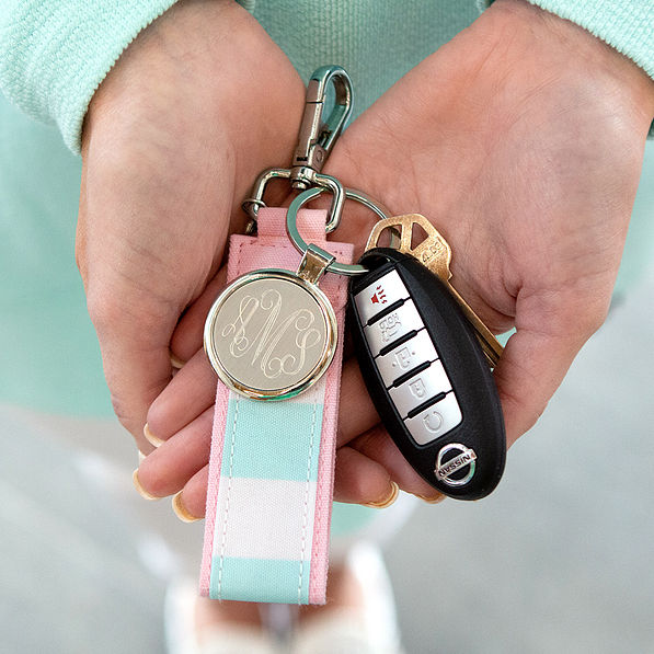 close up of cabana stripe keychain in hands